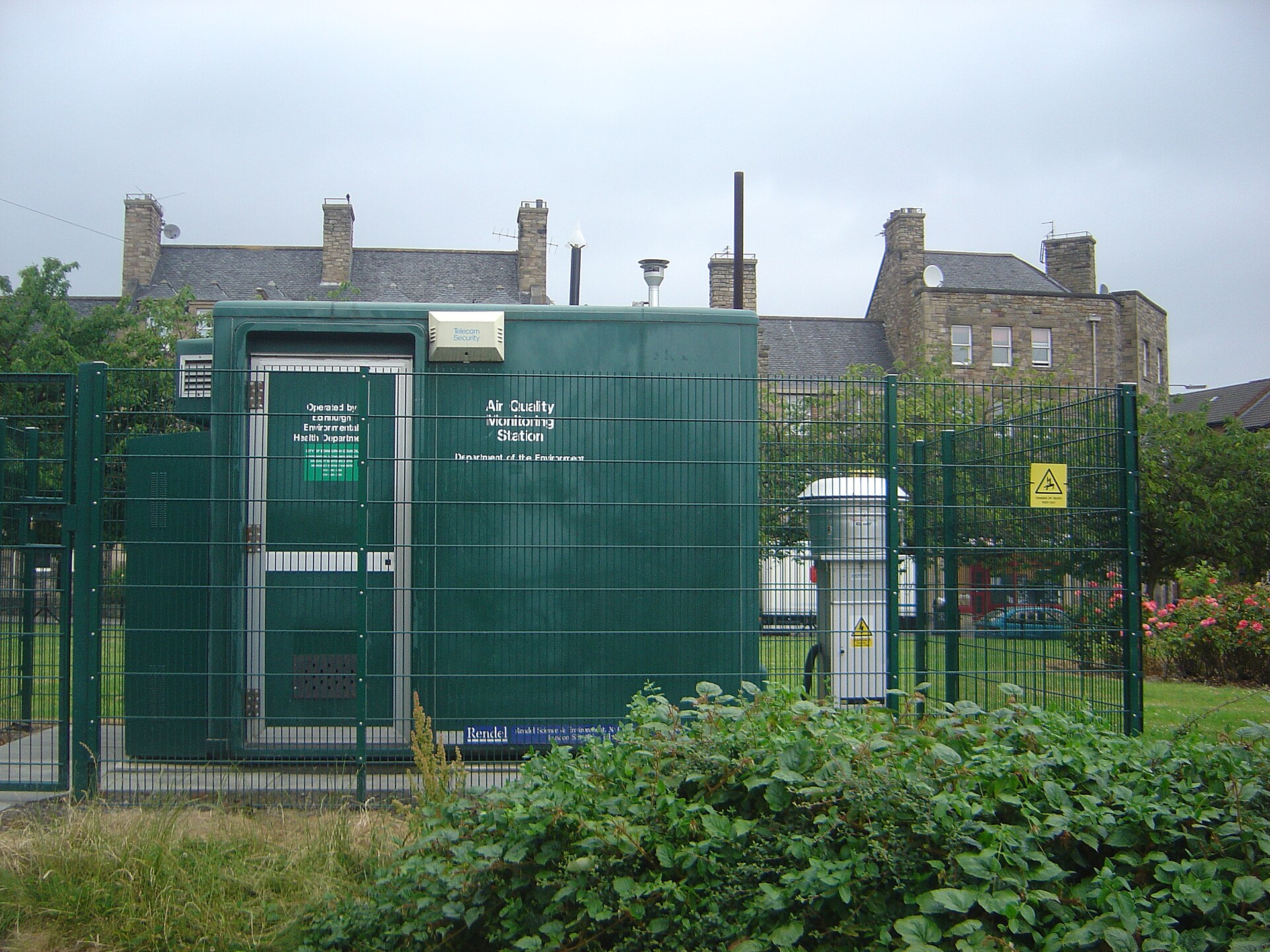 Outdoor air quality measurement station on a paved street.