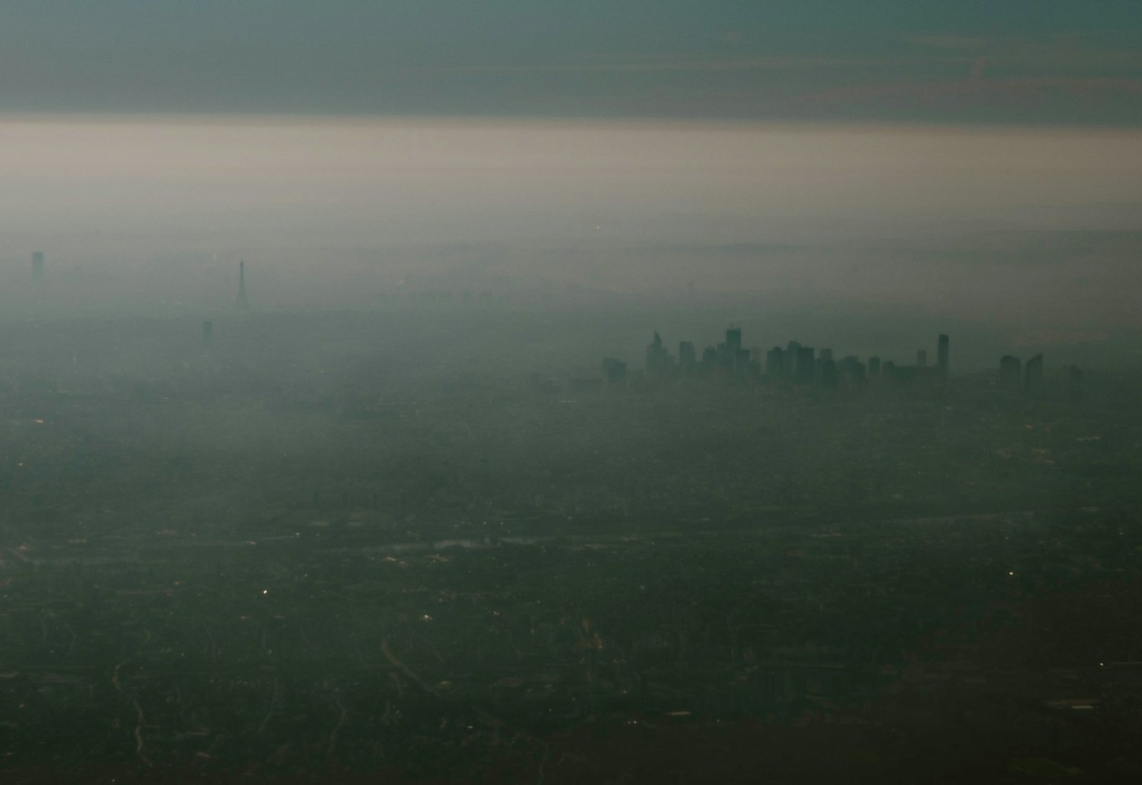 City skyline shrouded in dense smog.